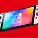 A Nintendo Switch OLED model is suspended in front of a red background.